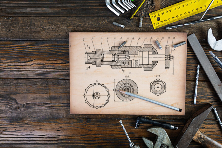 Set of working tools on wooden rustic background. Top view. Copy space